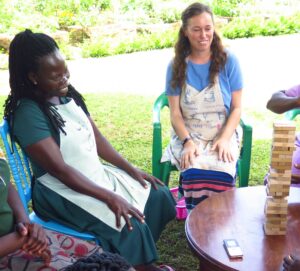 Lyndsay playing Jenga with the locals while learning Ma'di.