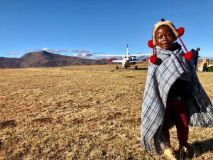 Lesotho child with MAF plane taken by Grant Strugnell missionary pilot